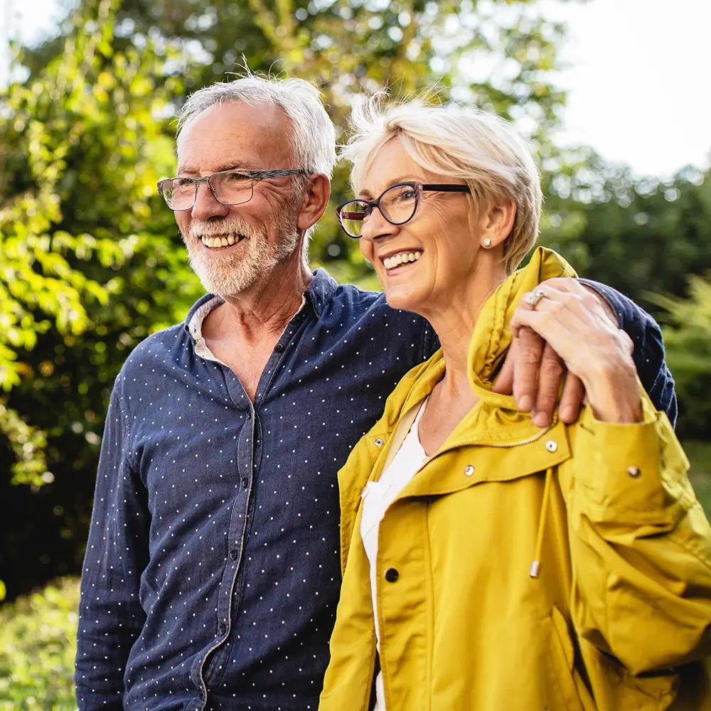 ABOUT Modern Living Senior couple smiling outdoors