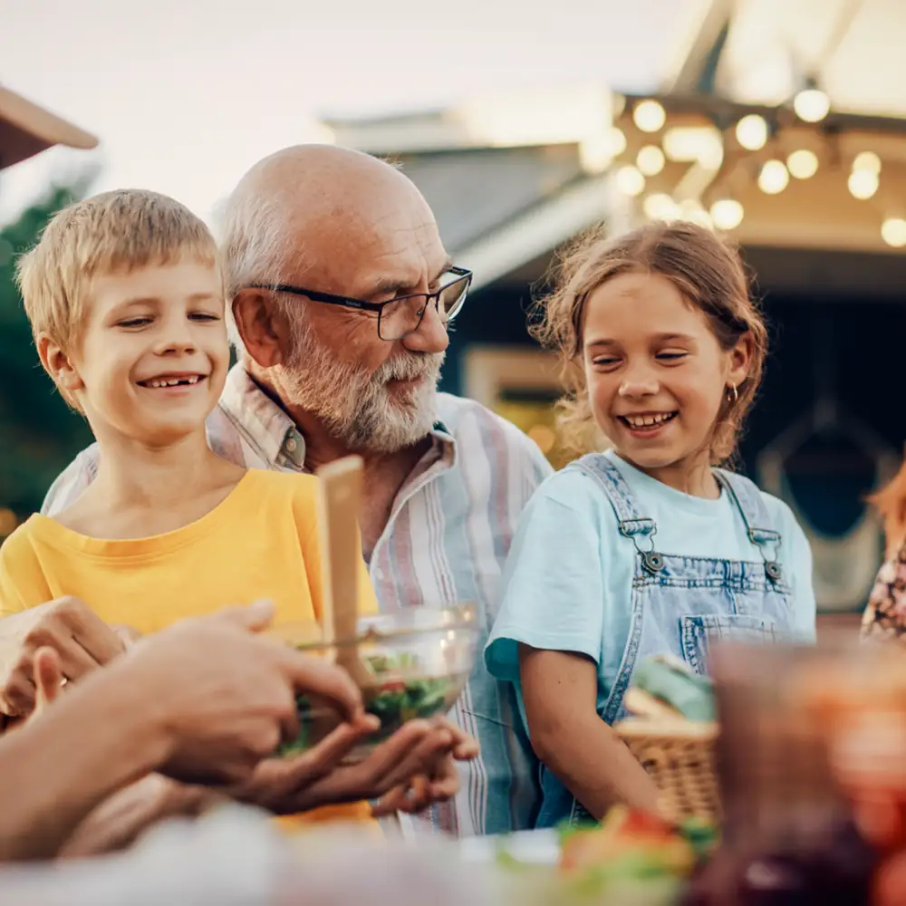 Senior man with his two young grandchildren