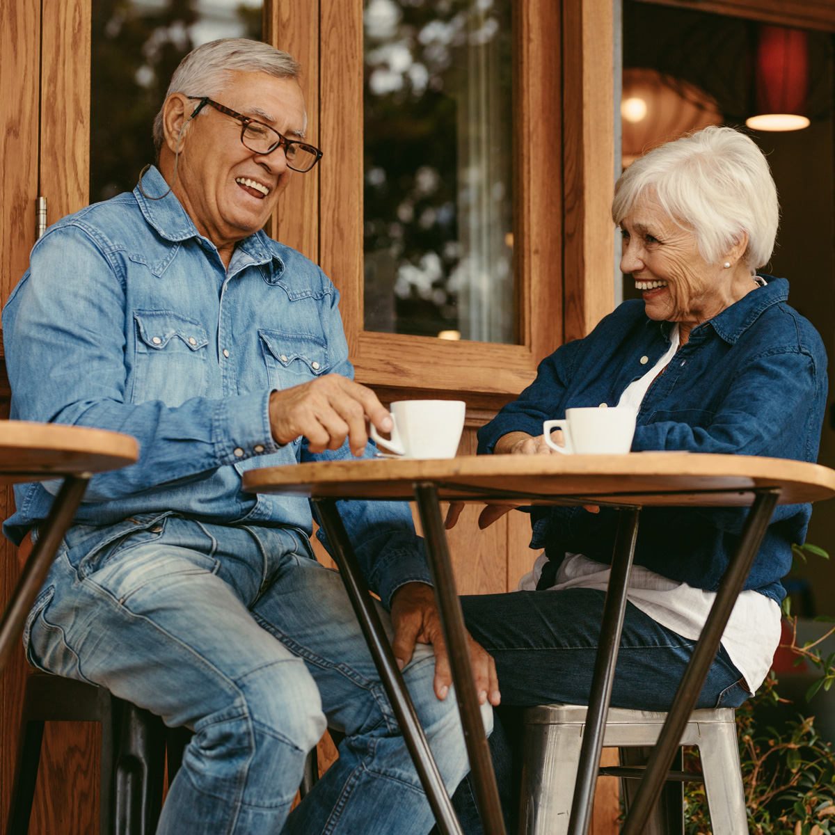 Senior couple smiling outdoors at night